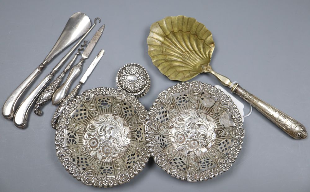 A pair of Edwardian pierced repousse silver bonbon dishes, Birmingham, 1901, 11.8cm, a box and minor flatware.